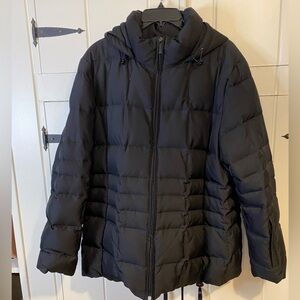 Calvin Klein puffer coat with faux fur lining and pockets with zippers.  Size L.